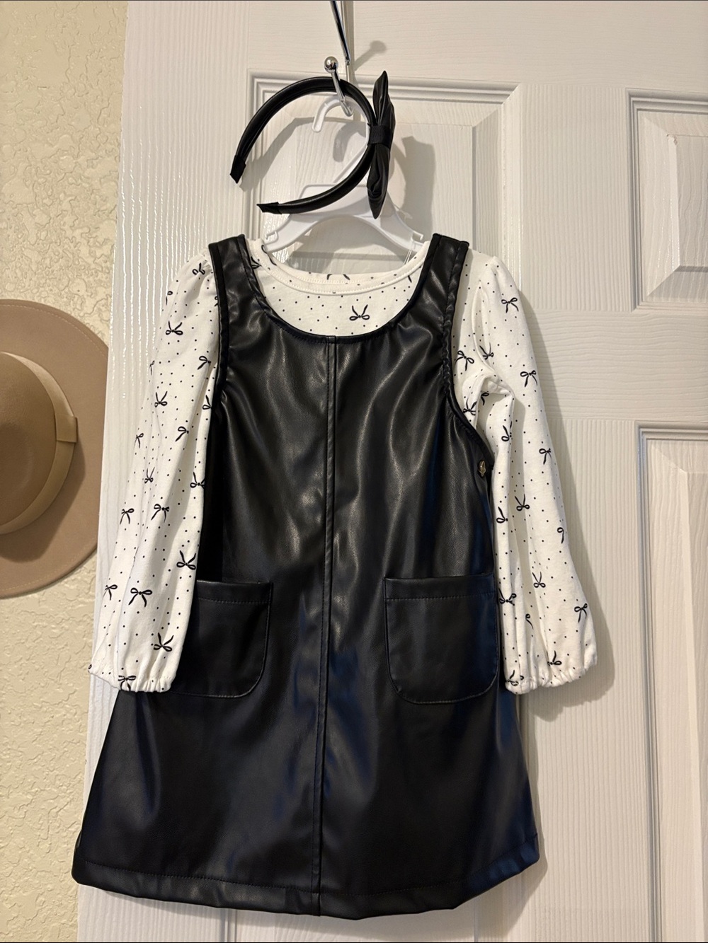 Girls Black Faux Leather Pinafore Dress with White Bow-Print Top